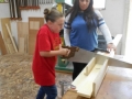 BRWC member Melissa Diaz shows the kids how to mark and cut.